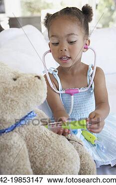 Picture - girl playing doctor.  fotosearch - search  stock photos,  pictures, wall  murals, images,  and photo clipart
