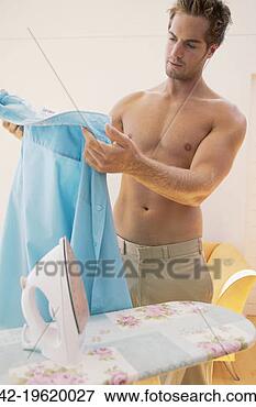 Picture - man ironing shirt.  fotosearch - search  stock photos,  pictures, wall  murals, images,  and photo clipart