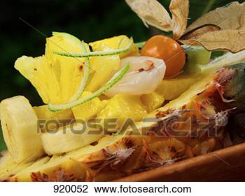 Stock Photo - exotic fruit salad 
in half a pineapple. 
fotosearch - search 
stock photos, 
pictures, images, 
and photo clipart