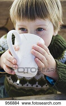 Stock Photo - small boy drinking 
hot drink in the 
open air. fotosearch 
- search stock 
photos, pictures, 
images, and photo 
clipart
