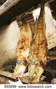 Stock Photograph - steckerlfisch 
(grilled fish 
on sticks, oktoberfest, 
munich). fotosearch 
- search stock 
photos, pictures, 
images, and photo 
clipart