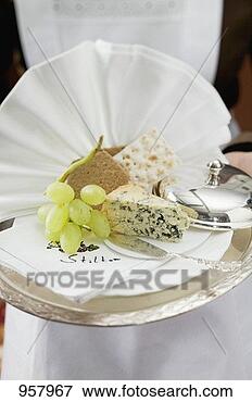 Picture - waitress serving 
blue cheese with 
bread and grapes. 
fotosearch - search 
stock photos, 
pictures, images, 
and photo clipart