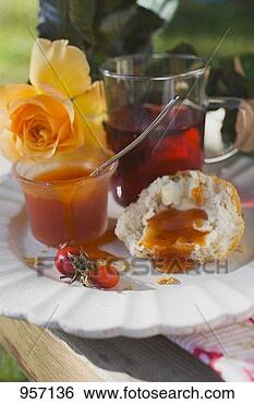 Stock Photo - rose hip jam on 
bread roll, rose 
hip tea, yellow 
rose. fotosearch 
- search stock 
photos, pictures, 
images, and photo 
clipart