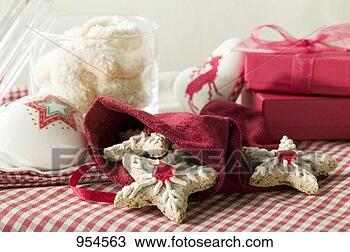 Stock Photo - assorted christmas 
biscuits, gifts, 
christmas decorations. 
fotosearch - search 
stock photos, 
pictures, images, 
and photo clipart