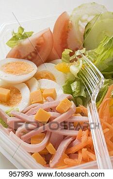 Stock Photo - iceberg lettuce, 
ham, cheese, egg 
& vegetables in 
plastic bowl. 
fotosearch - search 
stock photos, 
pictures, images, 
and photo clipart