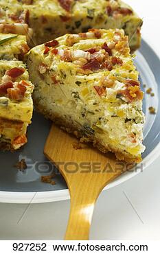 Stock Photo - leek and bacon 
quiche, a piece 
cut, with piece 
on server. fotosearch 
- search stock 
photos, pictures, 
images, and photo 
clipart