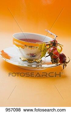 Stock Photo - rose hip tea in 
china cup, fresh 
rose hips in saucer. 
fotosearch - search 
stock photos, 
pictures, images, 
and photo clipart