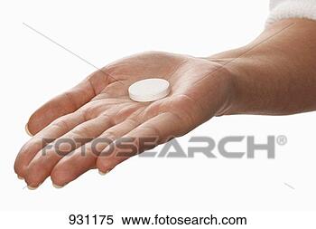 Stock Image - vitamin tablet 
lying in someoneæs 
hand. fotosearch 
- search stock 
photos, pictures, 
images, and photo 
clipart