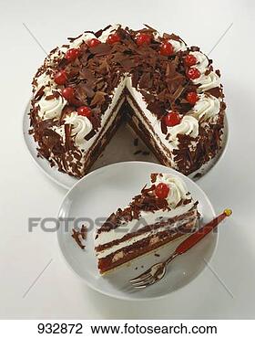 Stock Photo - black forest gateau 
with pieces taken 
& a piece on a 
plate. fotosearch 
- search stock 
photos, pictures, 
images, and photo 
clipart