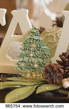 Stock Photo - christmas table 
decorations (christmas 
tree, cones). 
fotosearch - search 
stock photos, 
pictures, images, 
and photo clipart