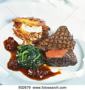 Stock Photograph - grilled beef steak 
with spinach. 
fotosearch - search 
stock photos, 
pictures, images, 
and photo clipart