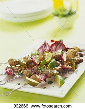 Stock Photo - lamb and onion 
kebabs with lime 
wedges. fotosearch 
- search stock 
photos, pictures, 
images, and photo 
clipart