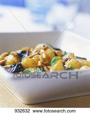 Stock Photo - new potato salad 
with pine nuts 
and basil. fotosearch 
- search stock 
photos, pictures, 
images, and photo 
clipart