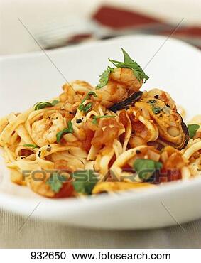 Stock Photography - noodles with seafood 
and tomato sauce. 
fotosearch - search 
stock photos, 
pictures, images, 
and photo clipart