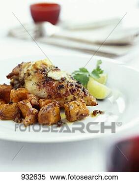 Stock Image - roast chicken 
with sweet potatoes. 
fotosearch - search 
stock photos, 
pictures, images, 
and photo clipart