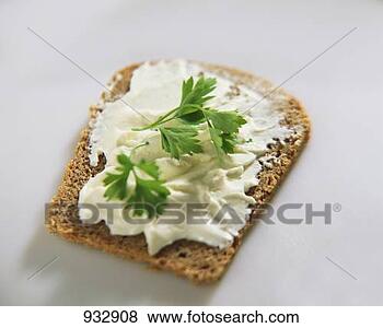 Stock Photo - soft cheese and 
parsley on wholemeal 
bread. fotosearch 
- search stock 
photos, pictures, 
images, and photo 
clipart