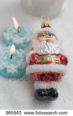 Stock Photo - tealights and 
father christmas 
(christmas tree 
ornament). fotosearch 
- search stock 
photos, pictures, 
images, and photo 
clipart