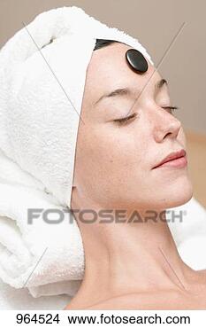 Stock Photo - woman having hot 
stone therapy 
(healing therapy 
using stones). 
fotosearch - search 
stock photos, 
pictures, images, 
and photo clipart