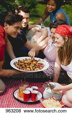 Stock Photo - young people at 
a 4th of july 
picnic (usa). 
fotosearch - search 
stock photos, 
pictures, images, 
and photo clipart