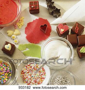 Stock Photo - baking still life 
with edible decorations 
& chocolate squares. 
fotosearch - search 
stock photos, 
pictures, images, 
and photo clipart