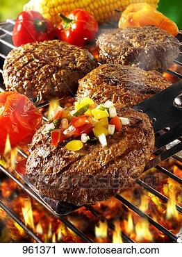 Stock Photography - burgers with vegetables 
on barbecue rack 
and spatula. fotosearch 
- search stock 
photos, pictures, 
images, and photo 
clipart