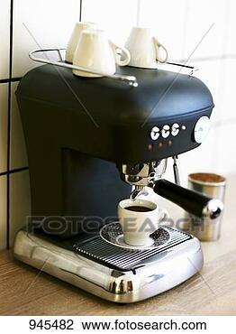 Stock Photo - a cup of espresso 
on espresso machine. 
fotosearch - search 
stock photos, 
pictures, images, 
and photo clipart