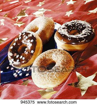 Stock Image - four doughnuts 
on a star-patterned 
cloth. fotosearch 
- search stock 
photos, pictures, 
images, and photo 
clipart