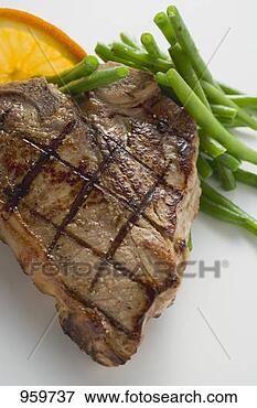 Picture - grilled t-bone 
steak with french 
beans. fotosearch 
- search stock 
photos, pictures, 
images, and photo 
clipart