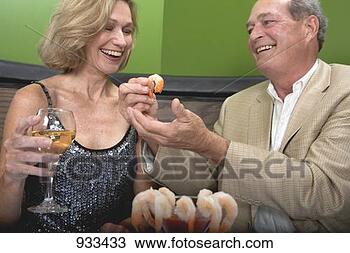 Stock Photo - man and woman 
eating shrimps 
in restaurant. 
fotosearch - search 
stock photos, 
pictures, images, 
and photo clipart
