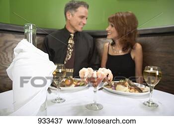 Picture - man and woman 
having dinner 
in a restaurant. 
fotosearch - search 
stock photos, 
pictures, images, 
and photo clipart