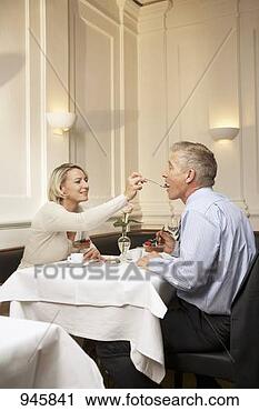 Stock Photography - mature couple 
enjoying dessert 
in a restaurant. 
fotosearch - search 
stock photos, 
pictures, images, 
and photo clipart