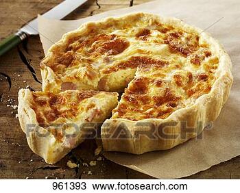 Stock Photo - quiche lorraine, 
a slice cut, on 
baking parchment. 
fotosearch - search 
stock photos, 
pictures, images, 
and photo clipart