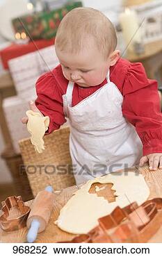 Stock Photo - baby holding cut-out 
christmas biscuit. 
fotosearch - search 
stock photos, 
pictures, images, 
and photo clipart