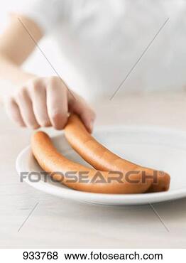 Stock Photo - child's hand reaching 
for a frankfurter. 
fotosearch - search 
stock photos, 
pictures, images, 
and photo clipart