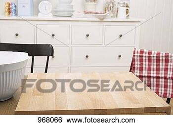 Stock Photo - kitchen scene 
with large chopping 
board on table. 
fotosearch - search 
stock photos, 
pictures, images, 
and photo clipart