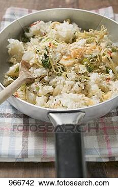 Stock Photo - pan-cooked rice 
and fish dish 
with lemon zest 
(detail). fotosearch 
- search stock 
photos, pictures, 
images, and photo 
clipart