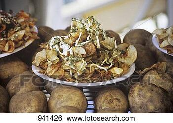 Stock Photo - plate of fried 
potato chips on 
whole potatoes 
at a fair. fotosearch 
- search stock 
photos, pictures, 
images, and photo 
clipart