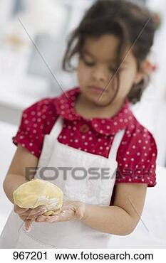 Stock Photography - small girl forming 
dough into a ball. 
fotosearch - search 
stock photos, 
pictures, images, 
and photo clipart