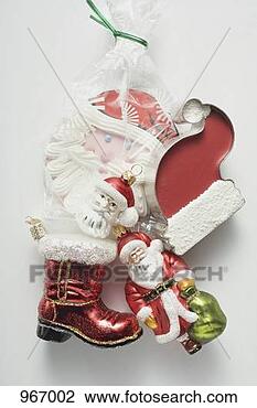 Stock Photo - sweet father christmas 
hat, christmas 
tree ornaments 
& biscuit. fotosearch 
- search stock 
photos, pictures, 
images, and photo 
clipart