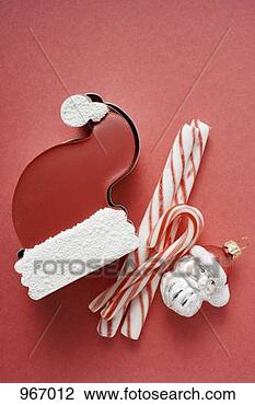 Stock Photo - sweet father christmas 
hat, candy canes 
& christmas tree 
ornament. fotosearch 
- search stock 
photos, pictures, 
images, and photo 
clipart