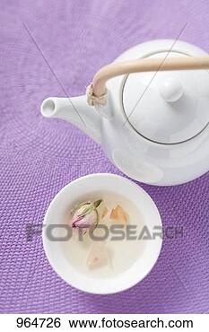 Stock Photo - teapot and bowl 
of rose tea. fotosearch 
- search stock 
photos, pictures, 
images, and photo 
clipart