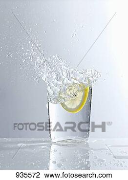 Stock Photo - water splashing 
out of a glass. 
fotosearch - search 
stock photos, 
pictures, images, 
and photo clipart