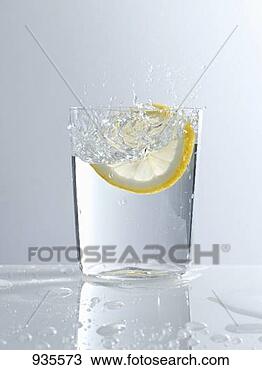 Stock Photo - water splashing 
out of a glass. 
fotosearch - search 
stock photos, 
pictures, images, 
and photo clipart