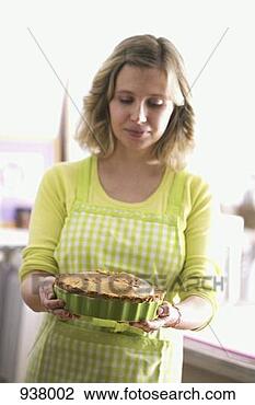 Stock Photo - woman holding 
an apple pie. 
fotosearch - search 
stock photos, 
pictures, images, 
and photo clipart