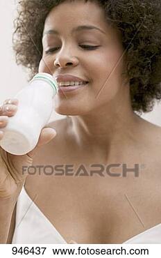 Picture - young woman drinking 
milk drink out 
of a plastic bottle. 
fotosearch - search 
stock photos, 
pictures, images, 
and photo clipart