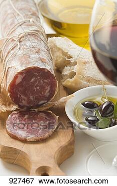 Picture - italian salami, 
olives in olive 
oil, white bread. 
fotosearch - search 
stock photos, 
pictures, images, 
and photo clipart