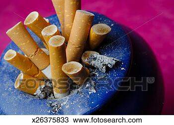 Stock Photo - cigarette butts 
in ashtray, close-up. 
fotosearch - search 
stock photos, 
pictures, images, 
and photo clipart