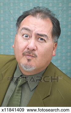 Stock Photograph - mature businessman 
pulling facial 
expression, portrait. 
fotosearch - search 
stock photos, 
pictures, images, 
and photo clipart