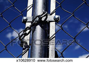 Stock Photography - chain around chain 
linked fence, 
close-up. fotosearch 
- search stock 
photos, pictures, 
images, and photo 
clipart