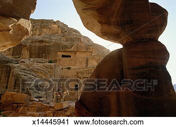 Stock Photography - jordan, petra, 
rock tombs, bedouin 
tribesman sitting 
on donkey. fotosearch 
- search stock 
photos, pictures, 
images, and photo 
clipart